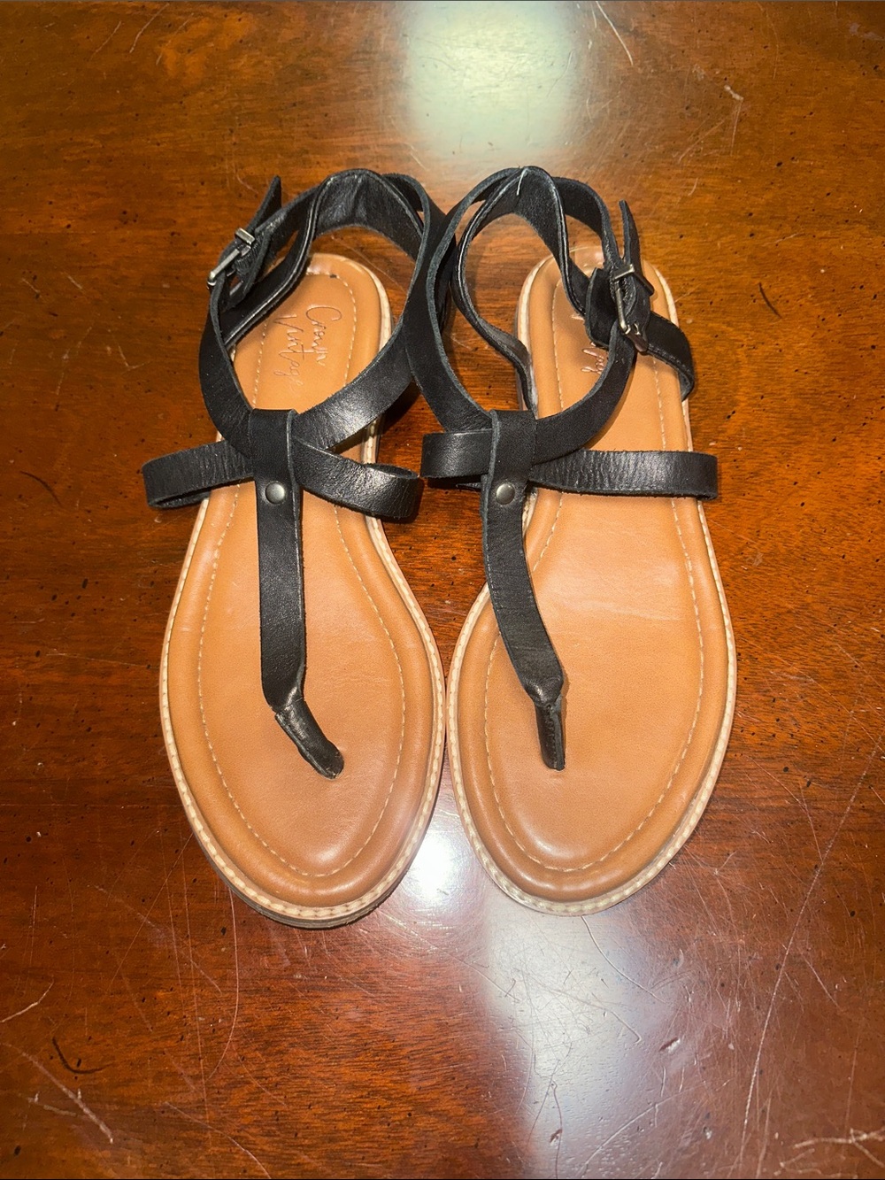 Women’s Black T-Strap Leather Sandals with Tan Footbed